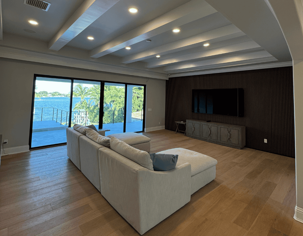 Modern living room with recessed ceiling lighting installed by professional electrician in Jupiter, Florida